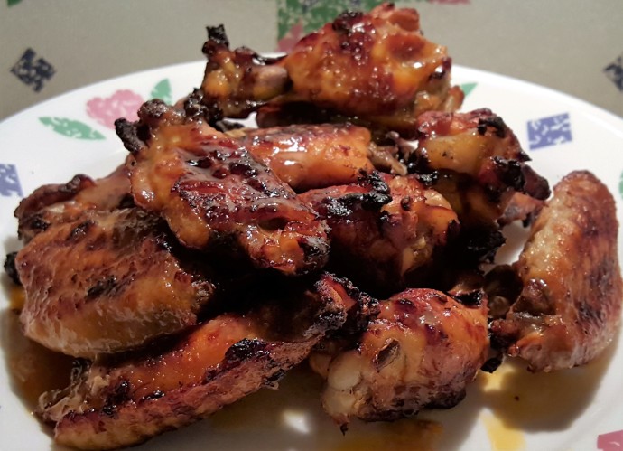 A plate of Asian Ginger Sticky Chicken Wings