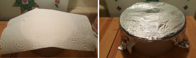 A cake pan with a paper towel on top of it  and then an image of foil on top of the paper towel.