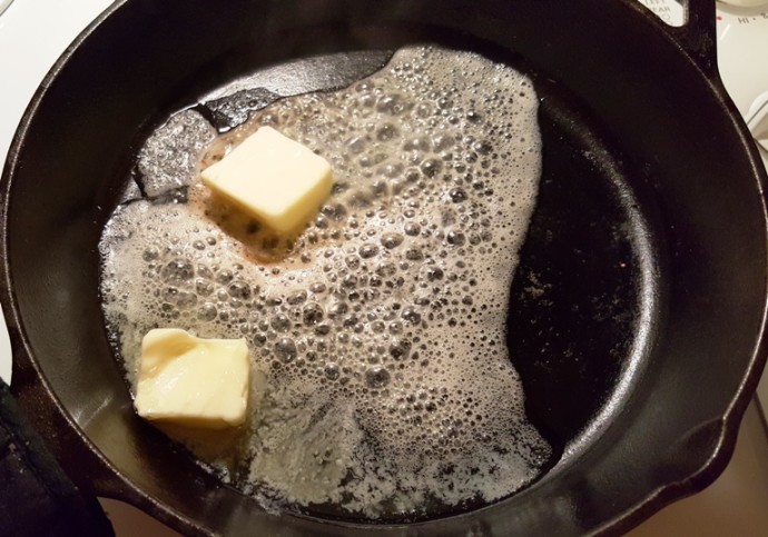 A drop of Oil and Butter is Added to a HOT Pan