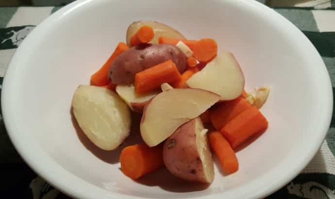 A bowl of potatoes and carrots