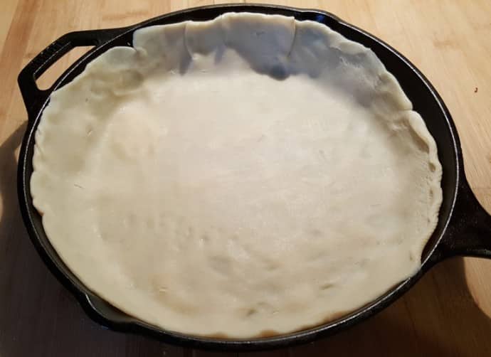 Place Bottom Crust into 10 inch Cast Iron Skillet