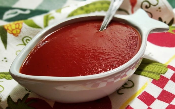 A close up of a bowl of BBQ sauce