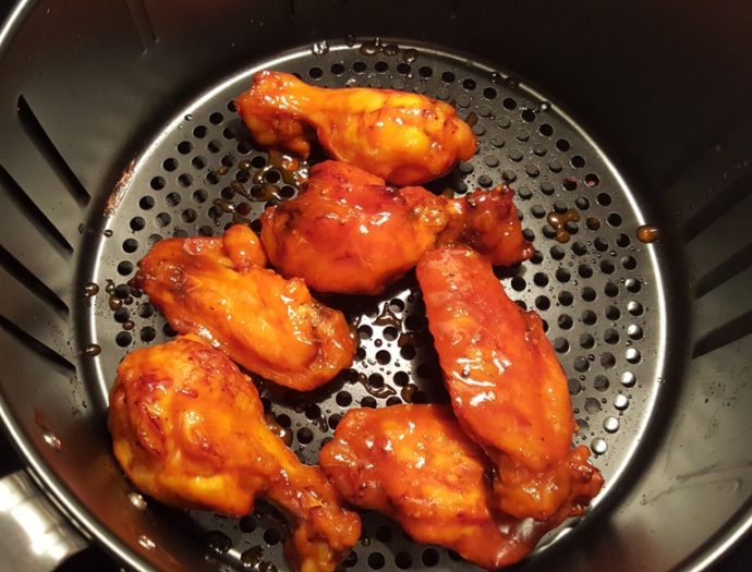 Air fryer with basted chicken wings