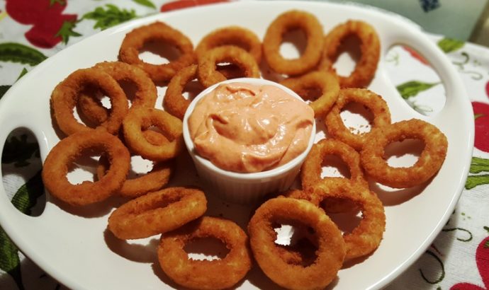 Serving plate with onion rings and Better than Bloomin’ Onion Ring Dipping Sauce in the centre