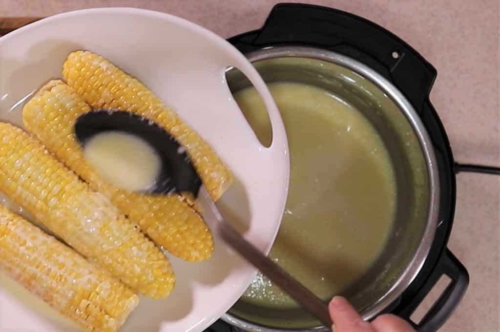 Spoon Butter Liquid Over Corn to Serve