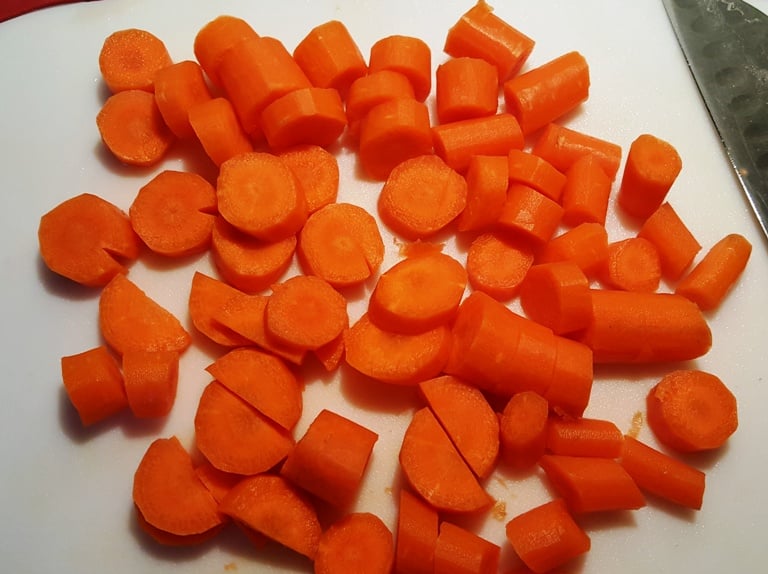 Carrots chopped on a chopping board.