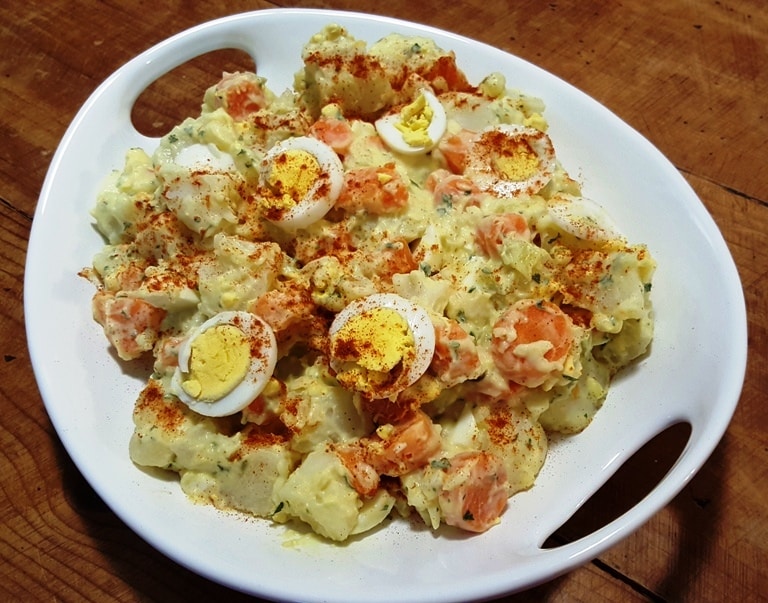 A plate of Instant Pot Potato Salad with Carronts on a table