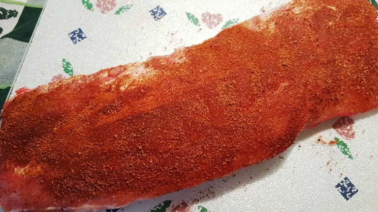 Massage the dry rub into the ribs