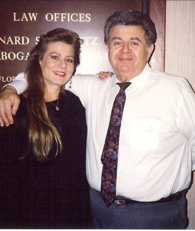 A man and woman posing for a photo