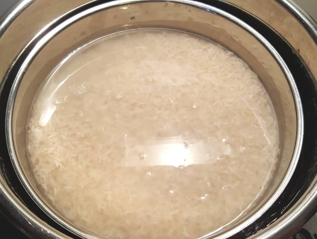Raw Rice and Fresh Water on top of Trivet