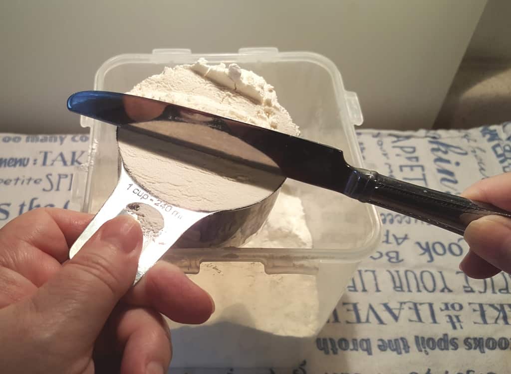 Use the Back Side of Knife to Level the Flour
