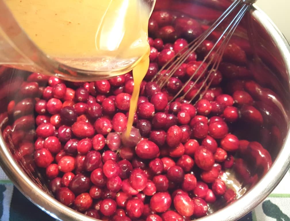 Pour the Orange Ginger Juice over the Cranberries