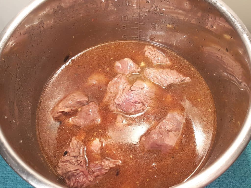 Add the Beef Stew Meat back into the Pressure Cooker cooking pot