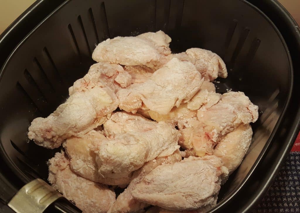 Carefully place Chicken Wings in Air Fryer