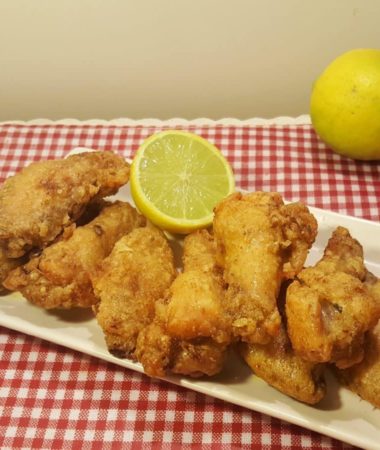 Air Fryer Crispy Old Bay Chicken Wings with a slice of Lemon
