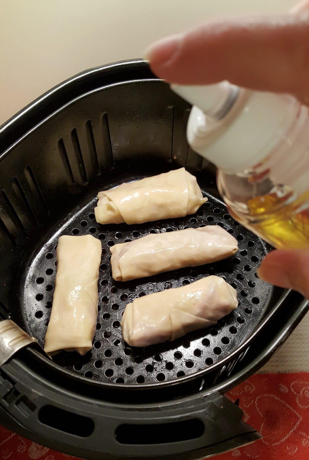 Spray the Egg Rolls with Oil