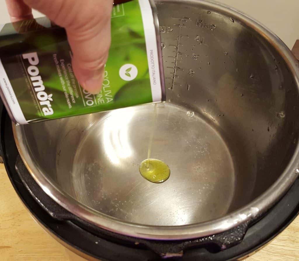 Add Olive Oil to Hot Pressure Cooker Cooking Pot