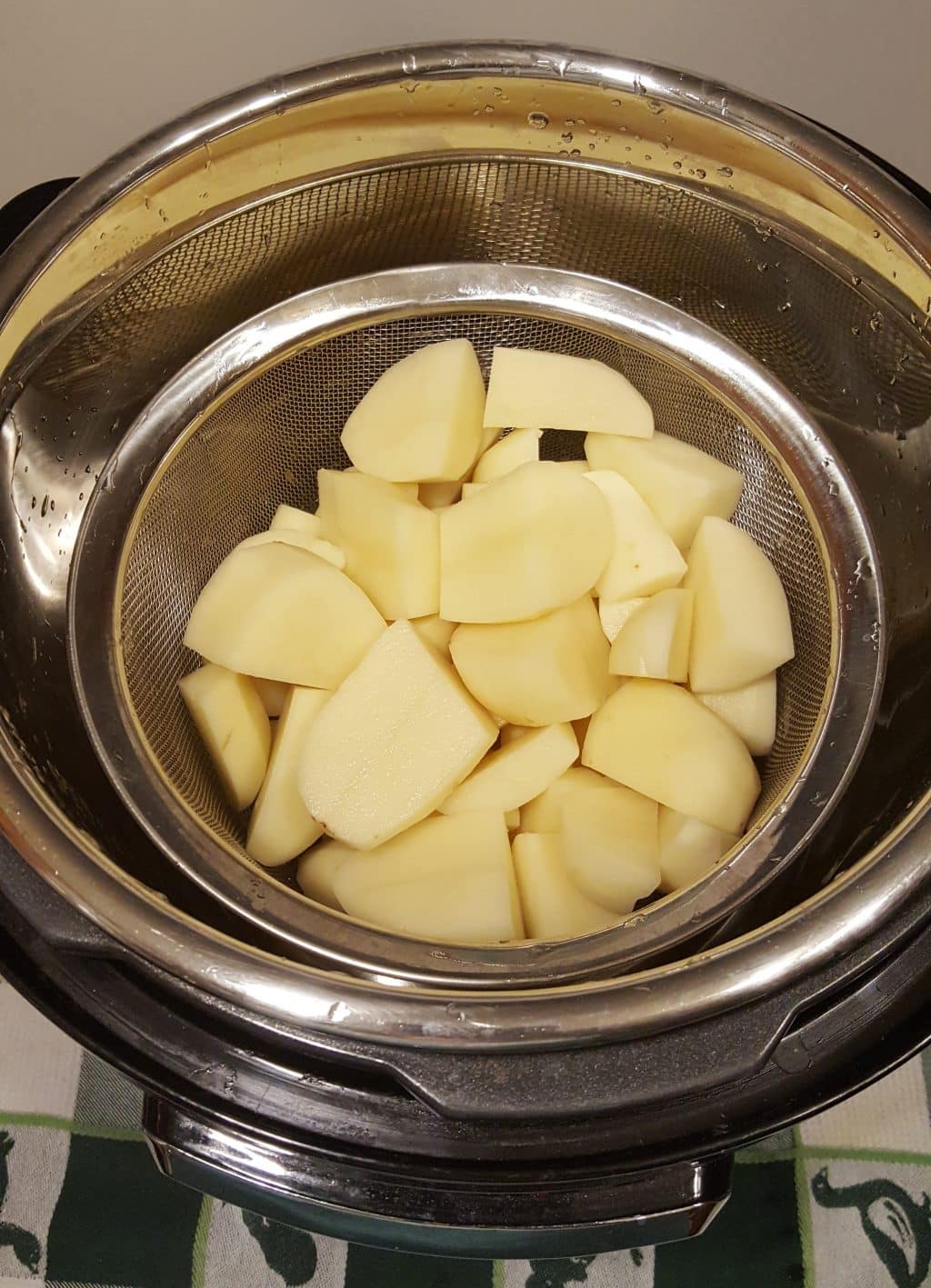 Add Basket of Quartered Potatoes to Cooking Pot