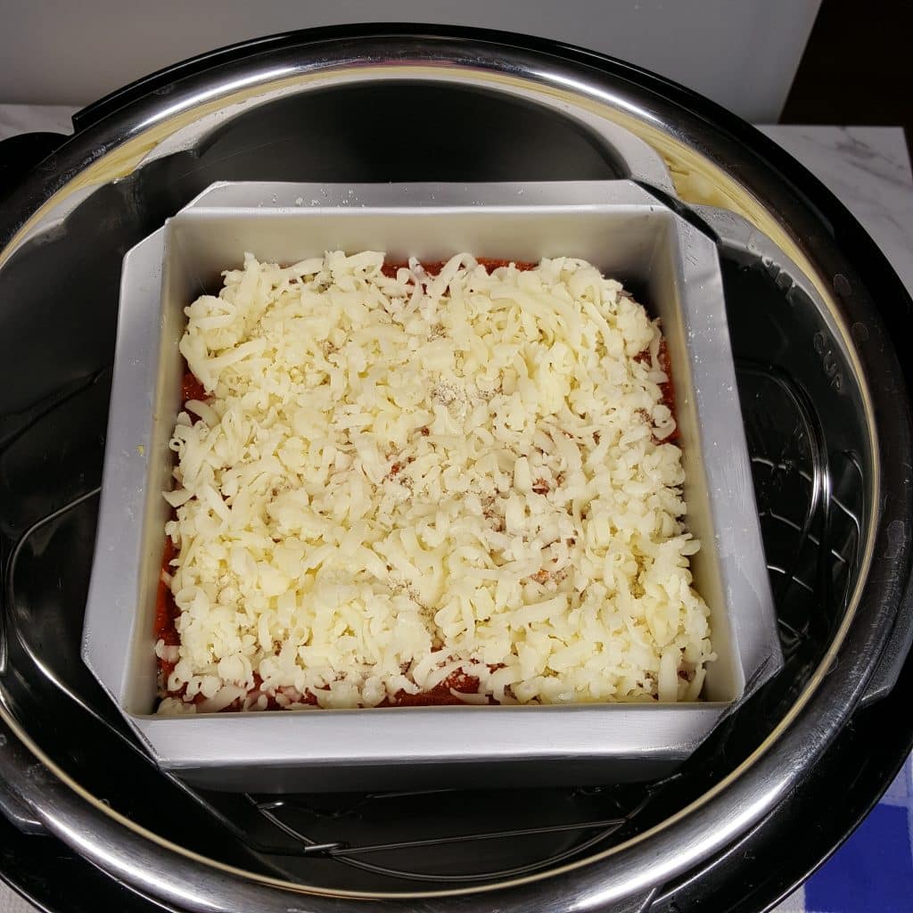Place Lasagna Pan into Pressure Cooker, over Water