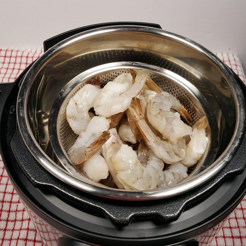 Place Basket of Shrimp into Pressure Cooker Fresh Frozen
