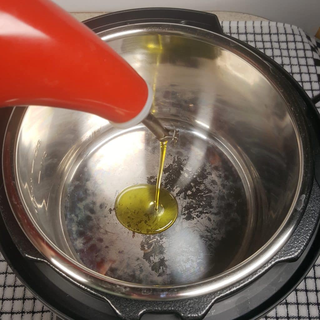 Heat up Pressure Cooker, then add Oil