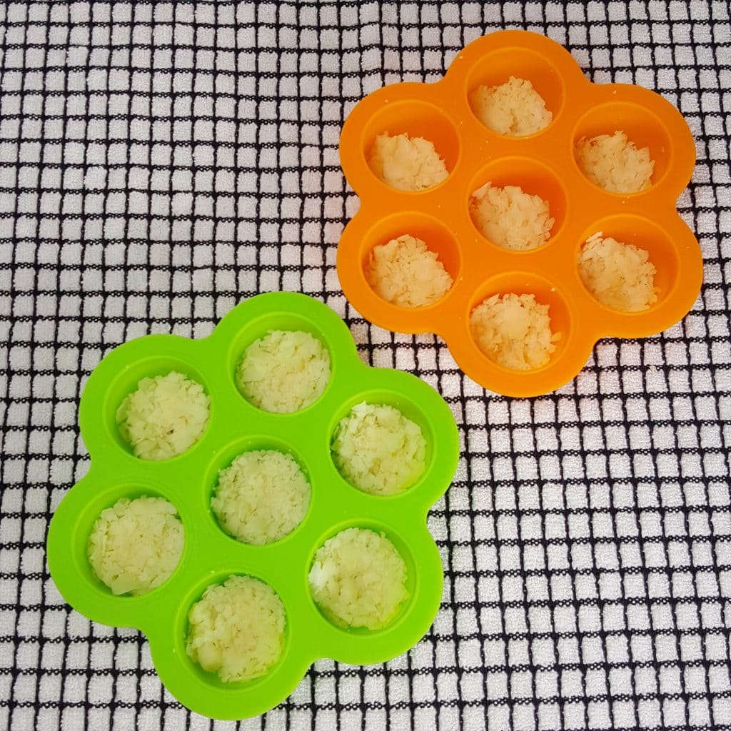 Mash the Shredded Cheese into Bottom of Silicone Molds