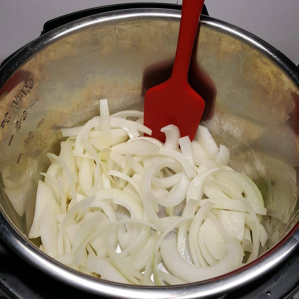 Add the Onions to the Cooking Pot