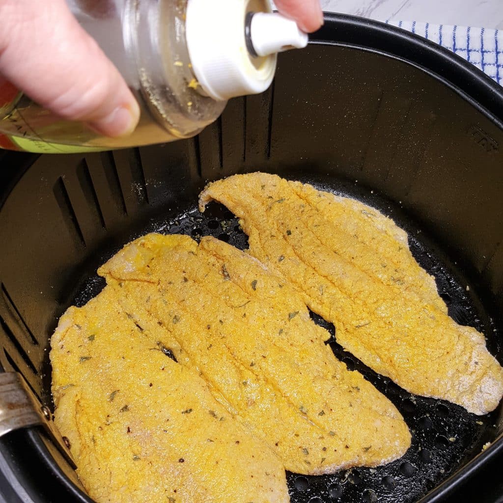 Mist the Catfish Fillets with Oil