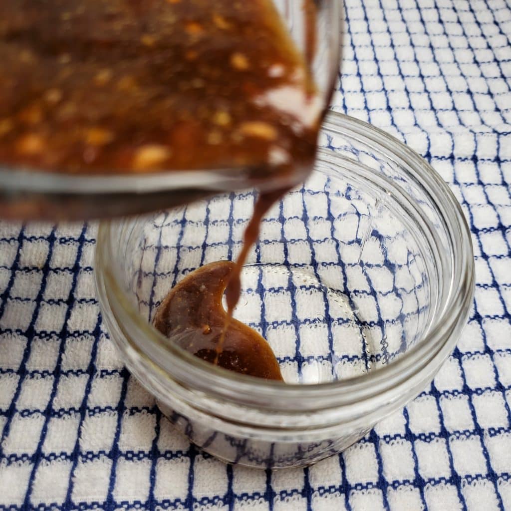 Pour Asian Stir Fry Sauce into Glass Jar
