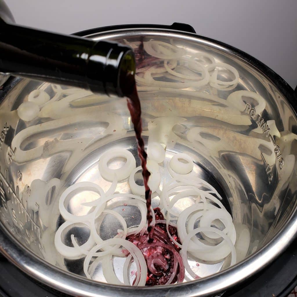 Sliced Onions and Red Wine in the Pot