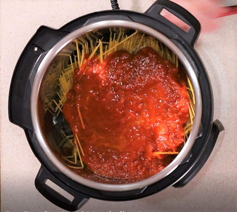 Cover the Spaghetti with the Large Jar of Spaghetti Sauce