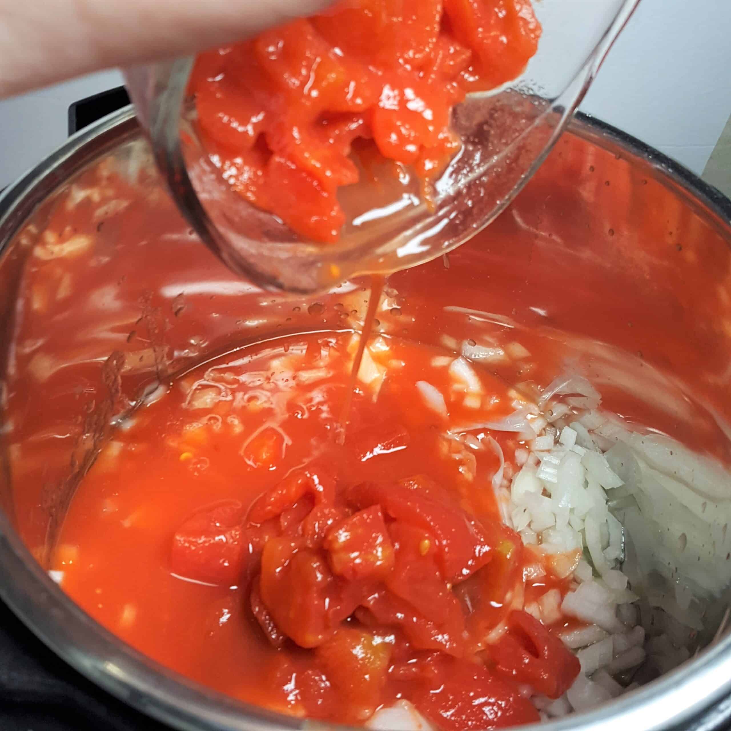 Pouring in Crushed Tomatoes